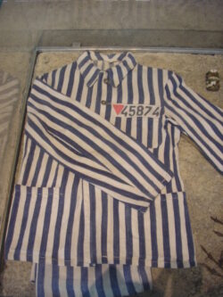 "Political prisoner's uniform, Sachsenhausen" by Walton Pantland is licensed under CC BY-NC-ND 2.0.